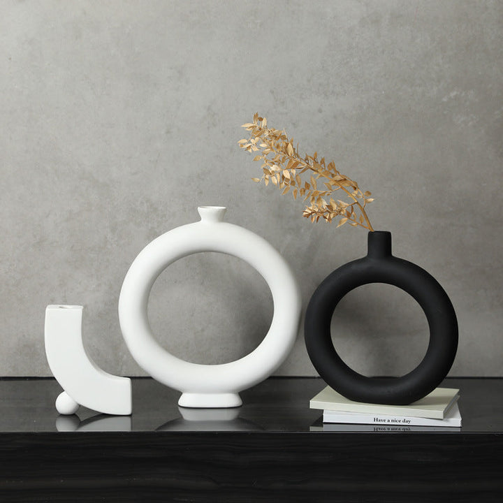 Black and white geometric ceramic vases on display
