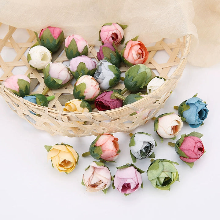 2cm Vintage Rose Buds Silk Flower Heads Pack 40 is a perfect addition to your decorative floral collection.