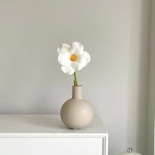 Small Wabi-Sabi style ceramic vase on tabletop