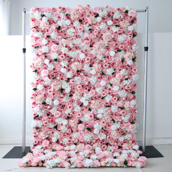 Close-up of blush pink and white floral wall backdrop with roses and hydrangeas.
