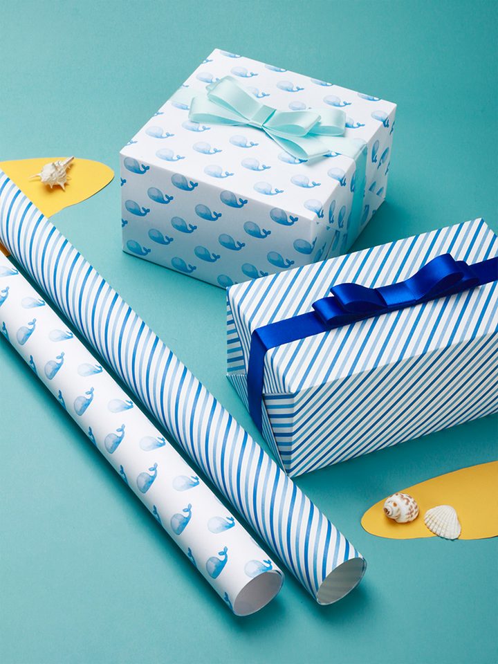 Premium gift wrap featuring anchors and aquatic life.