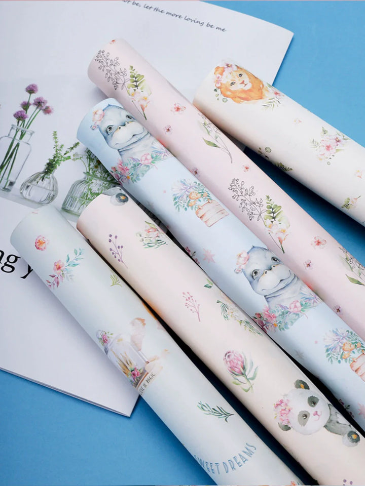 Whimsical floral wrapping paper with lion and panda designs.