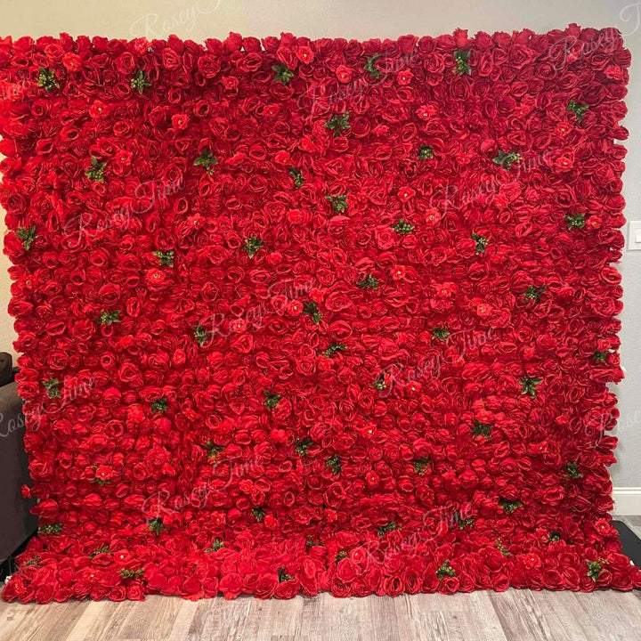 Bold red rose floral wall with greenery accents
