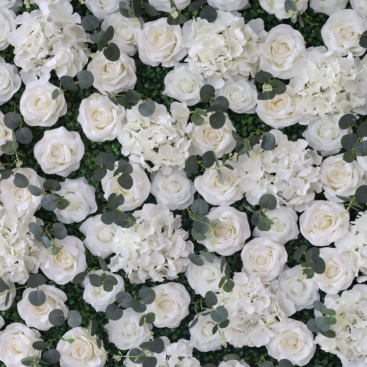 Stunning floral wall featuring white flowers and green leaves, ideal for elegant events.
