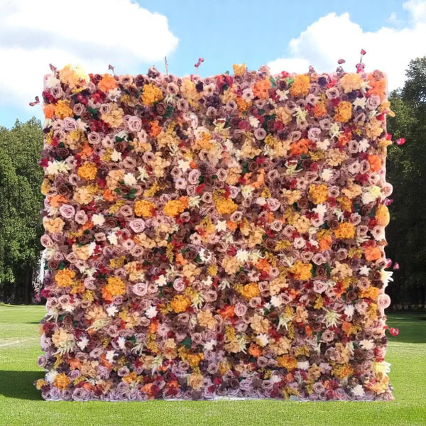 Rustic flower wall with warm-toned roses, marigolds, and fall foliage.
