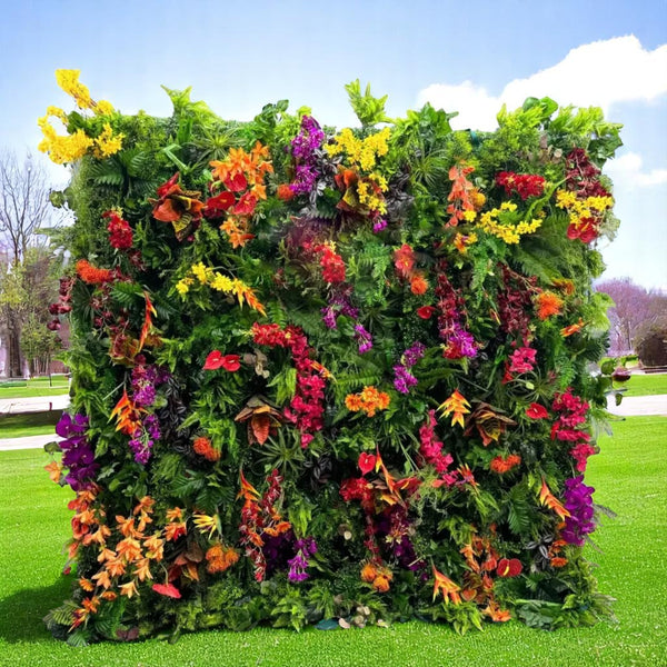 Colorful flower wall backdrop filled with vibrant blooms for weddings and events.