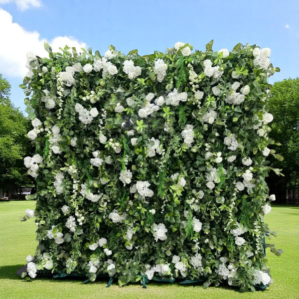 Lush green and white floral wall backdrop for weddings, featuring elegant roses and lush foliage.