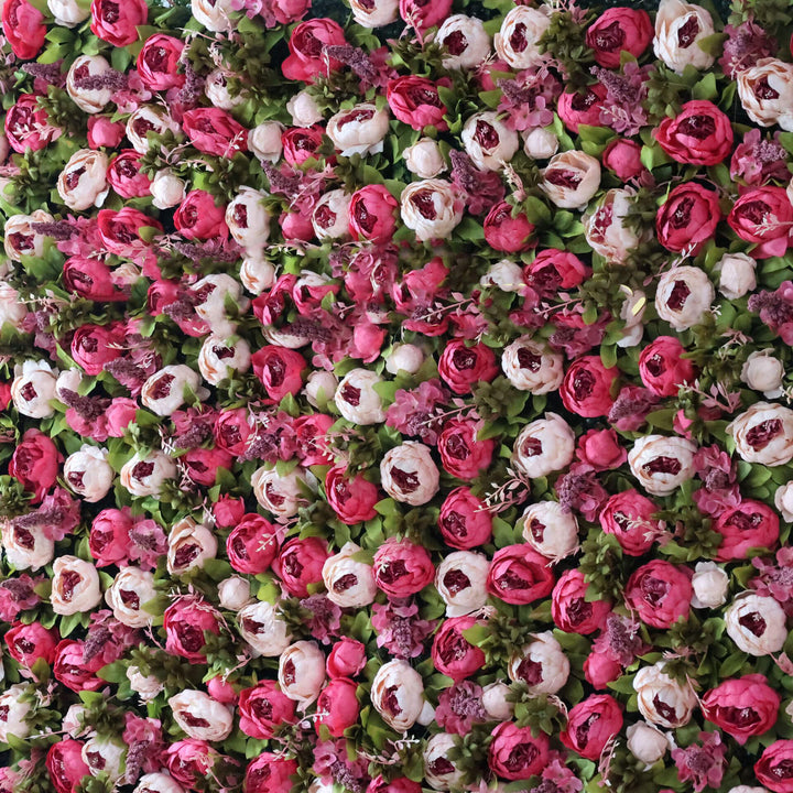 Elegant floral wall backdrop featuring a mix of red and blush roses.
