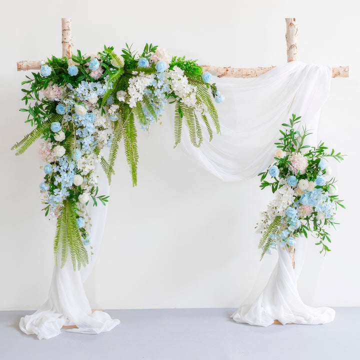 Pastel Blue & White Wedding Arch Decor With Hanging Greenery