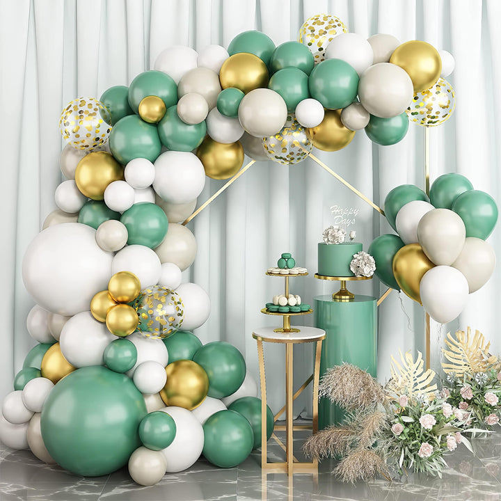 Green and gold balloon arch with elegant event decor
