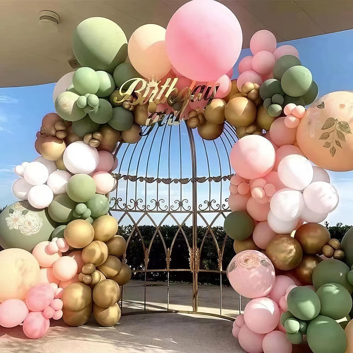 Elegant garden-themed balloon arch with pink, gold, and green balloons
