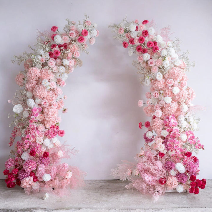 Delicate pink and white floral arch with a soft blend of roses and hydrangeas, perfect for adding a romantic touch to weddings and elegant events.