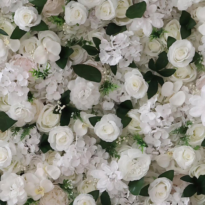 Luxurious white floral wall backdrop with lush green foliage for elegant occasions.
