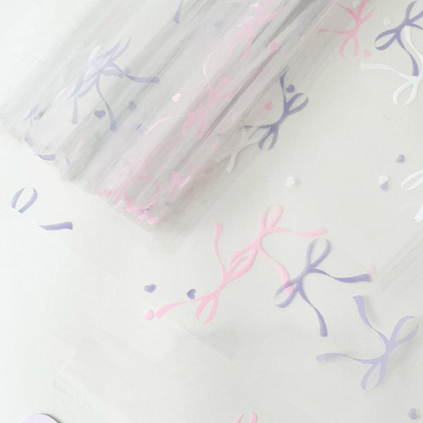 Bow Printed Cellophane Wrap Paper Pack 20 (57x57cm)