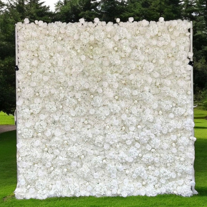 Elegant white flower wall backdrop with lush greenery for weddings