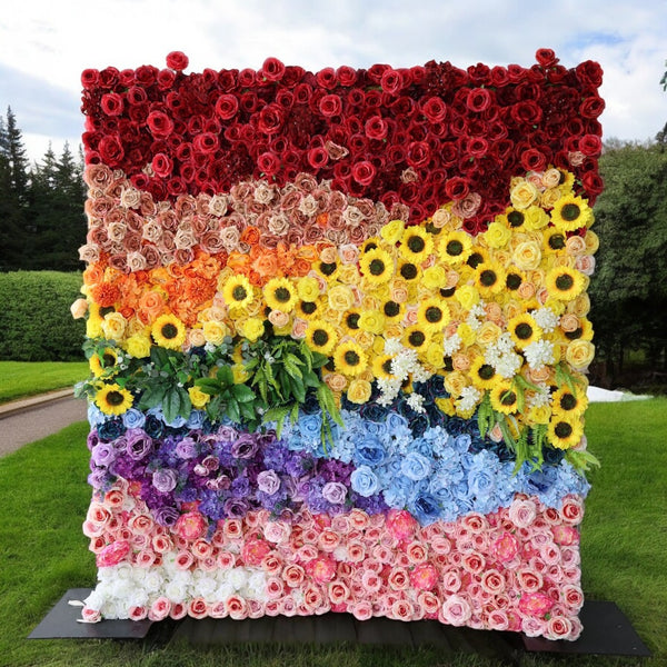 Vibrant rainbow floral wall backdrop with multicolored flowers.
