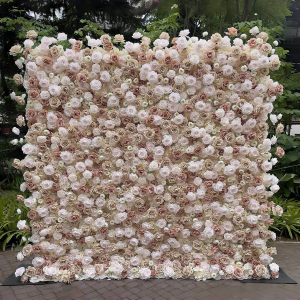 Champagne and blush floral wall backdrop with soft ivory roses.
