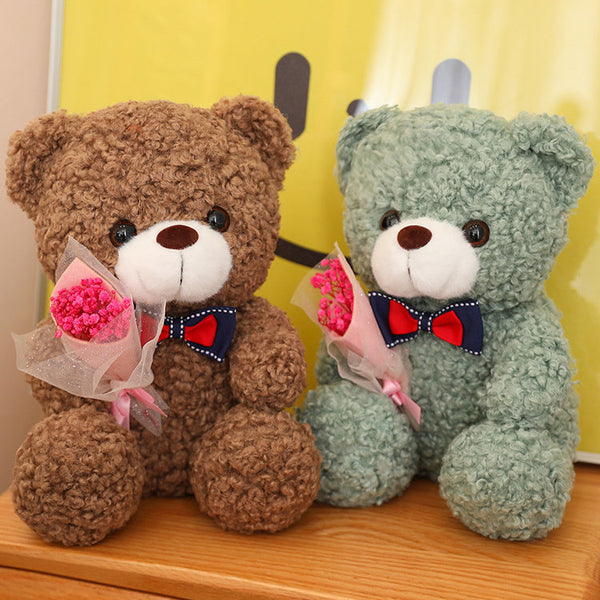 Teddy Bear Holding Bouquet 25cm is a delightful addition to your valentine's day bouquets collection.