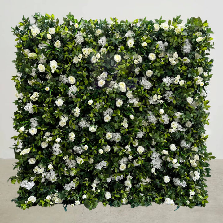 Evergreen Elegance floral wall backdrop with lush green foliage and white flowers.
