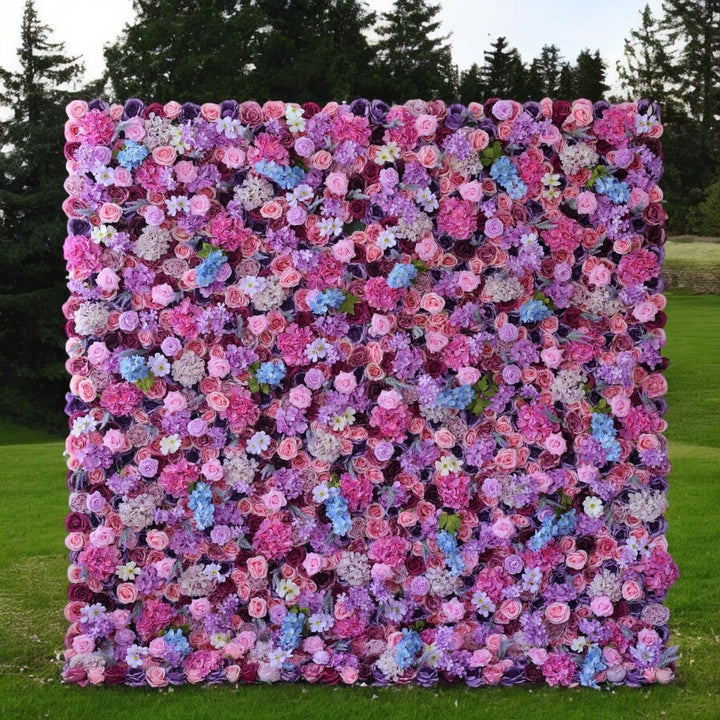 Mixed pink and purple artificial flower wall backdrop
