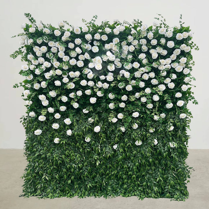 Lush green and white floral wall backdrop for events.
