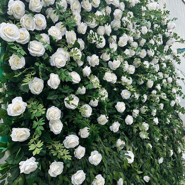 Elegant floral wall with white roses and vibrant greenery.
