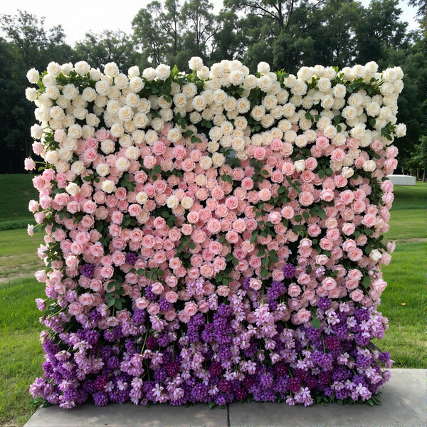 Pastel-colored floral wall backdrop with roses and lilacs for elegant events.