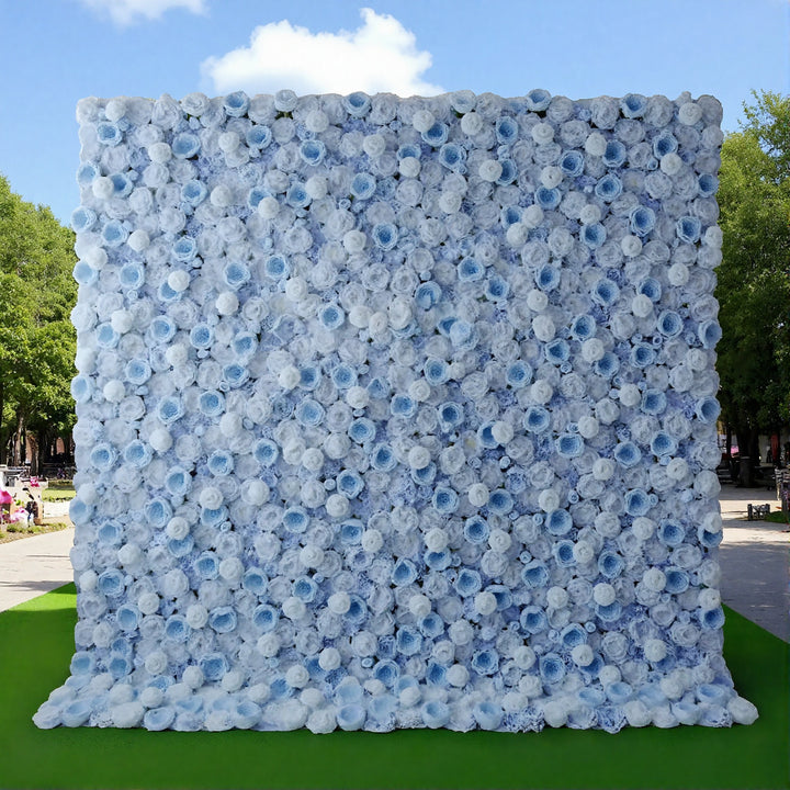 Blue flower backdrop behind modern white chair and table setup