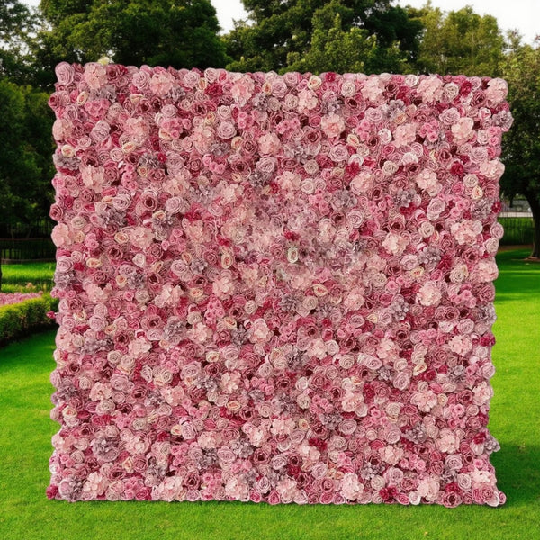 Full view of pink rose and hydrangea flower wall backdrop set up against a white background