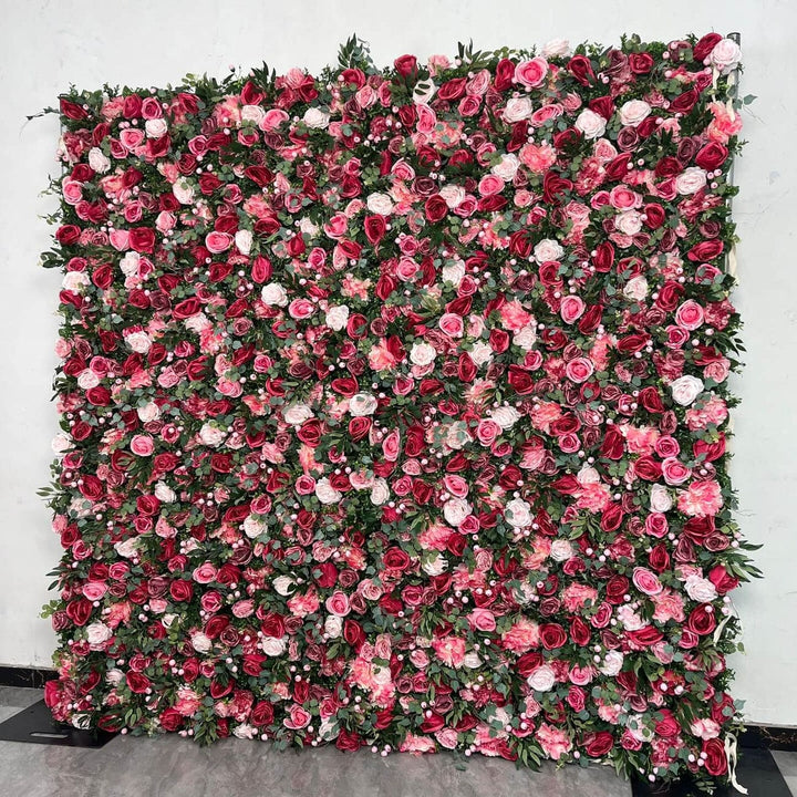 Rose Garden Romance flower wall backdrop with red and blush roses.
