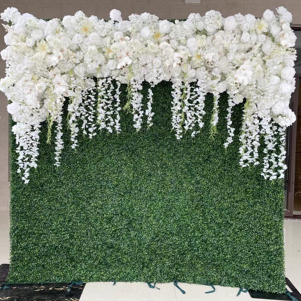 White floral cascading backdrop with greenery base
